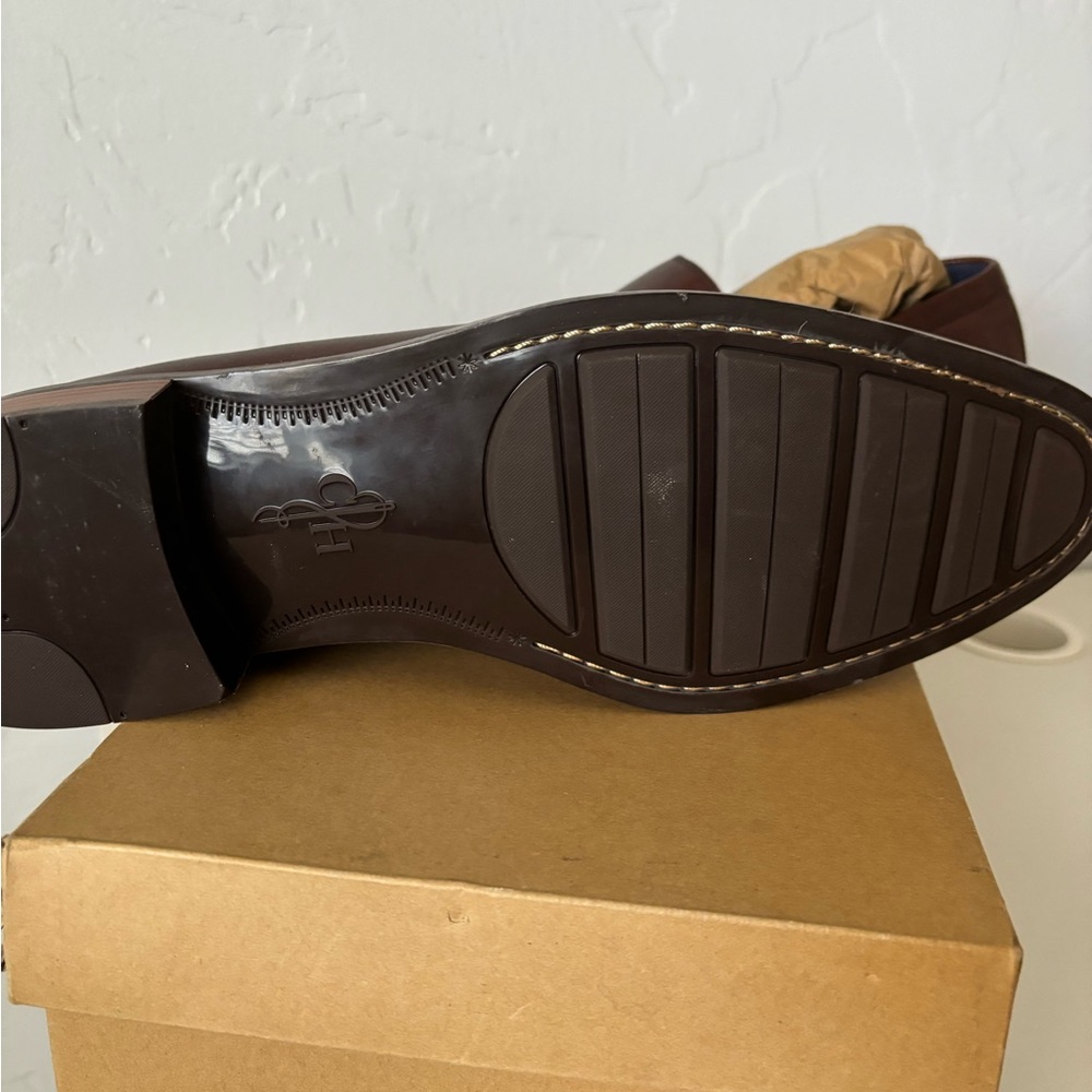 Brand new Men’s Cole Haan slip on dress shoes. Never worn.